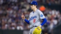 Los Angeles Dodgers pitcher Roki Sasaki (11) reacts against the Arizona Diamondbacks at Chase Field.
