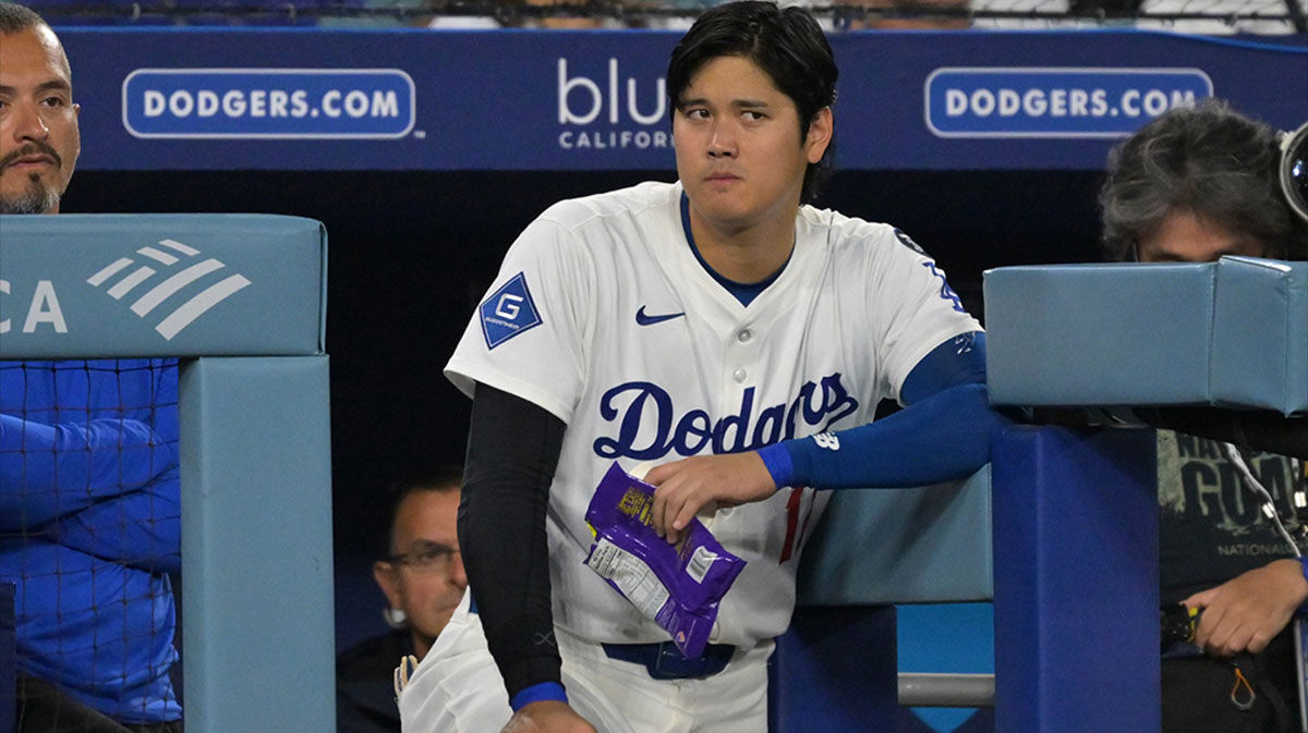 Los Angeles Dodgers designated hitter Shohei Ohtani (17) looks on from the dugout during the seventh inning against the Colorado Rockies at Dodger Stadium.