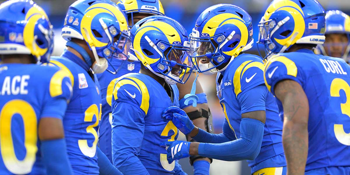 Los Angeles Rams safety Kam Curl (3) is congratulated after an interception in the fourth quarter against the Indianapolis Colts at SoFi Stadium.
