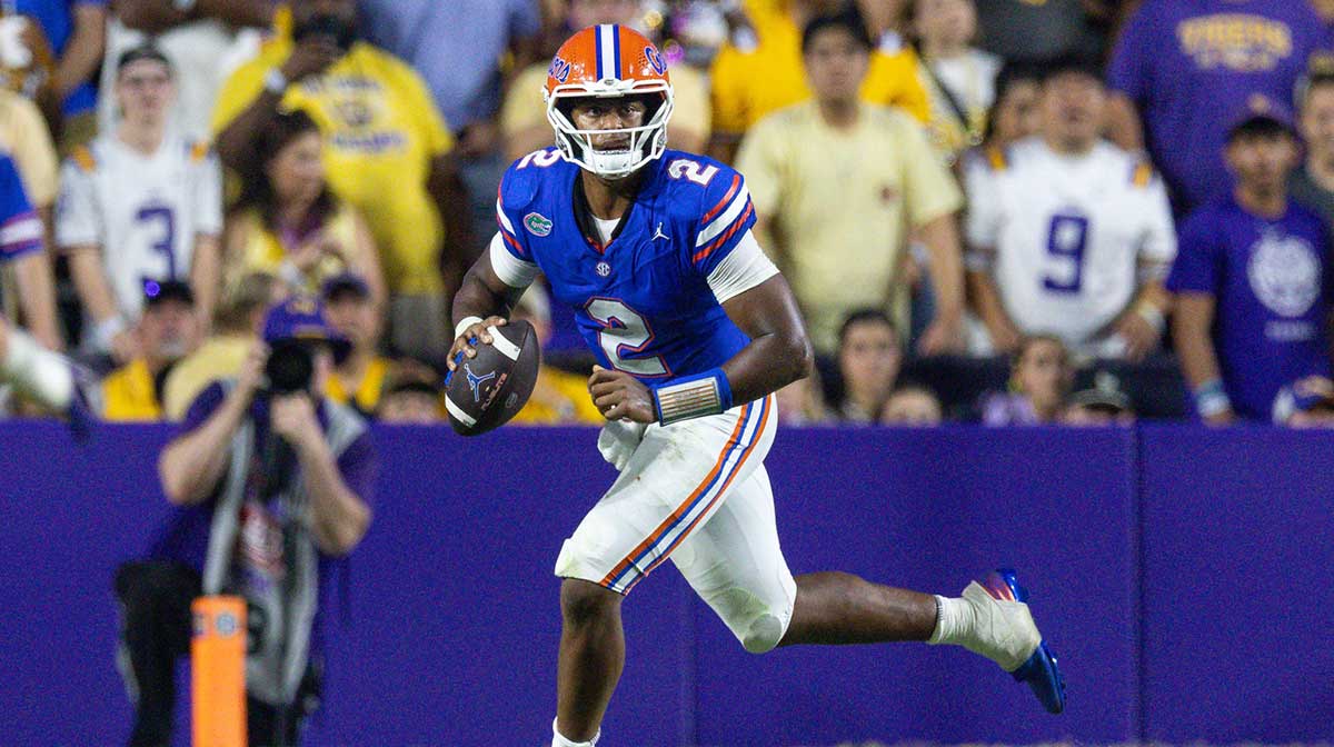 Florida Gators quarterback DJ Lagway (2) scrambles out the pocket to pass against the LSU Tigers during the second half at Tiger Stadium.
