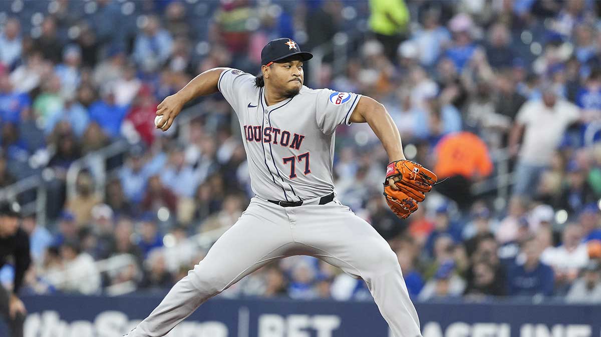 Houston Astros starting pitcher Luis Garcia (77) throws a pitch against the Toronto Blue Jays during the first inning at Rogers Centre