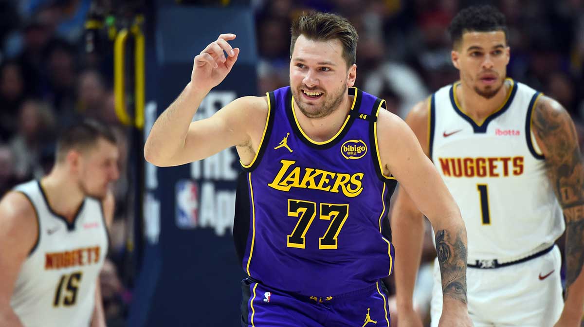 Los Angeles Lakers guard Luka Doncic (77) celebrates after a basket during the first half against the Denver Nuggets at Ball Arena.