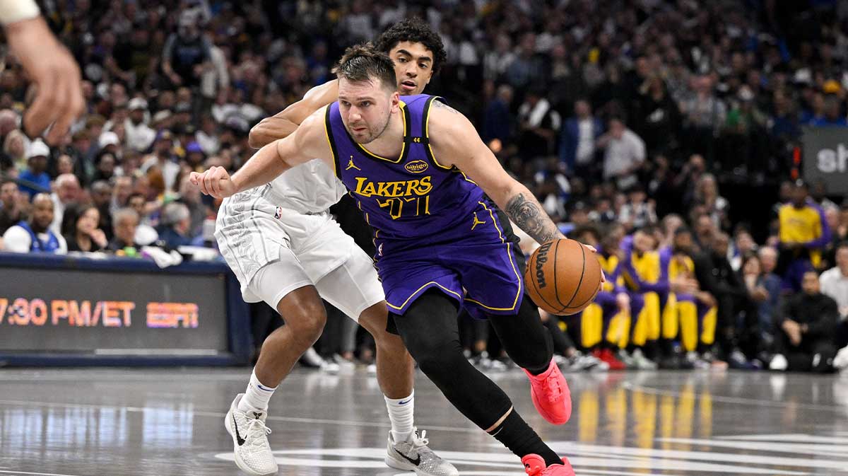 Dallas Mavericks guard Max Christie (00) and Los Angeles Lakers guard Luka Doncic (77) in action during the game between the Dallas Mavericks and the Los Angeles Lakers at American Airlines Center.