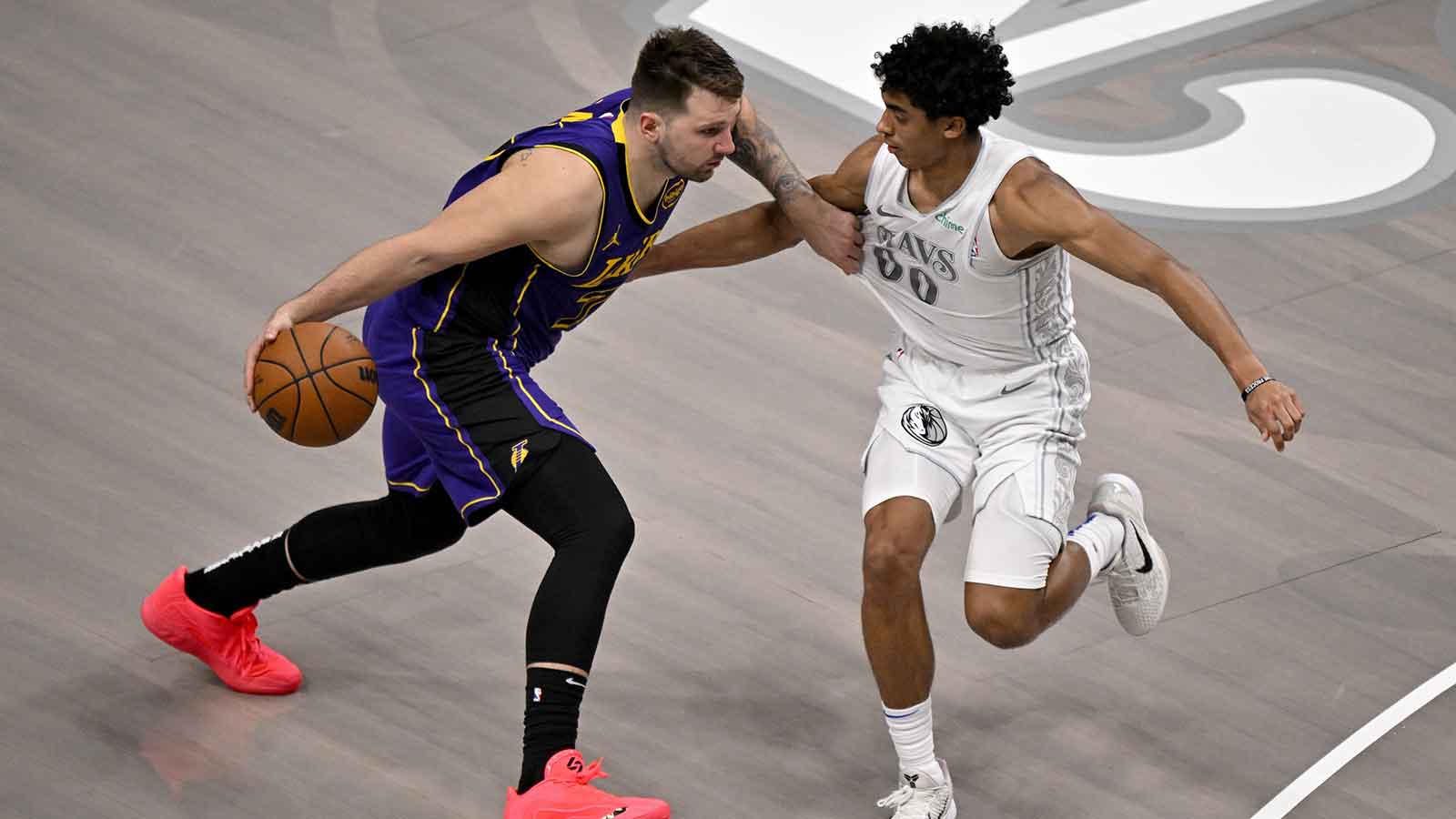 Los Angeles Lakers guard Luka Doncic (77) moves to the basket past Dallas Mavericks guard Max Christie (00) during the fourth quarter at the American Airlines Center. 