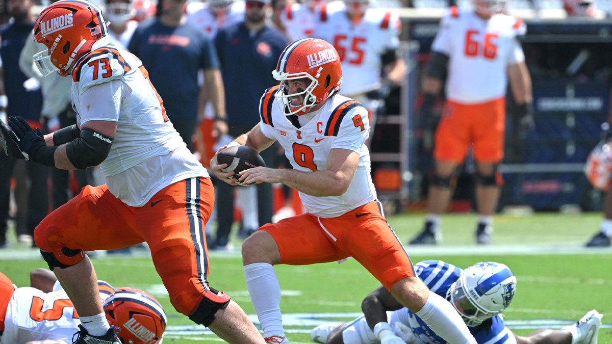 Illinois Fighting Illini quarterback Luke Altmyer (9) runs during the first quarter against the Duke Blue Devils at Wallace Wade Stadium.