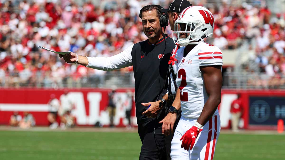 Wisconsin Badgers head coach Luke Fickell discusses a call with an official during the second quarter against the Alabama Crimson Tide at Saban Field at Bryant-Denny Stadium.