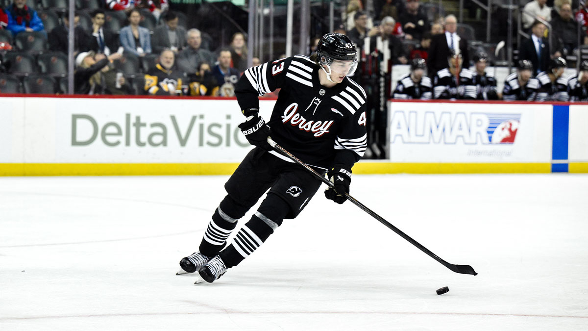 New Jersey Devils defenseman Luke Hughes (43) skates with the puck during the third period against the Pittsburgh Penguins at Prudential Center.