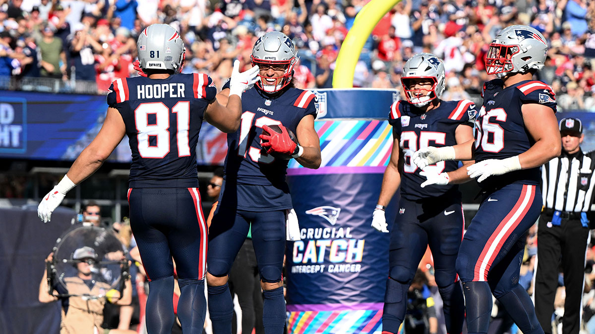 New England Patriots wide receiver Mack Hollins (13) celebrates with tight end Austin Hooper (81) after scoring a touchdown against the Carolina Panthers during the second half at Gillette Stadium.