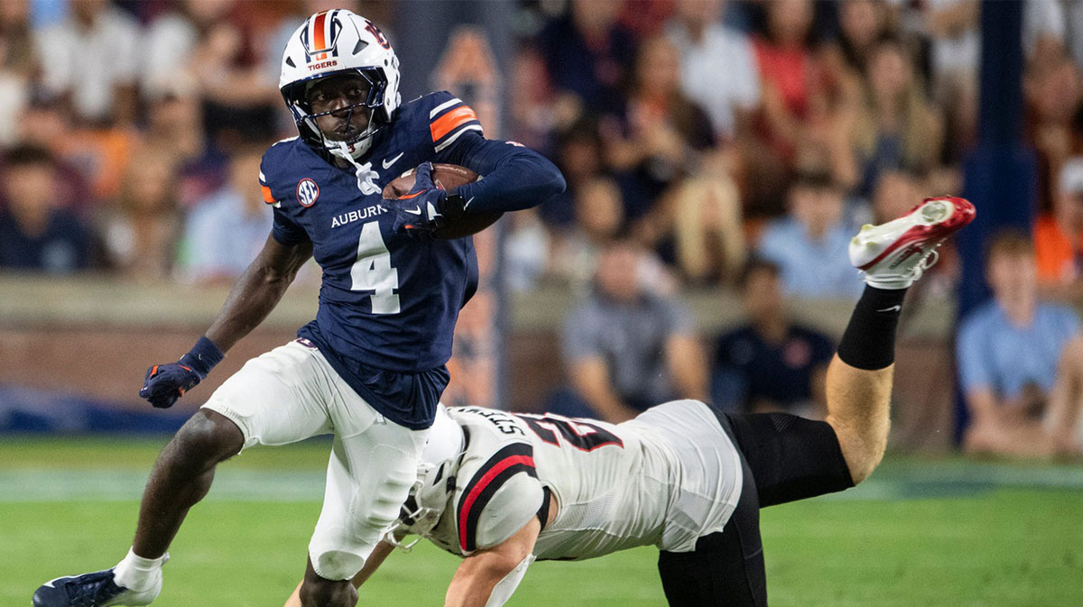 Auburn Tigers wide receiver Malcolm Simmons (4) returns a punt as Auburn Tigers take on Ball State Cardinals at Jordan-Hare Stadium in Auburn, Ala. on Saturday, Sept. 6, 2025. Auburn Tigers defeated Ball State Cardinals 42-3..