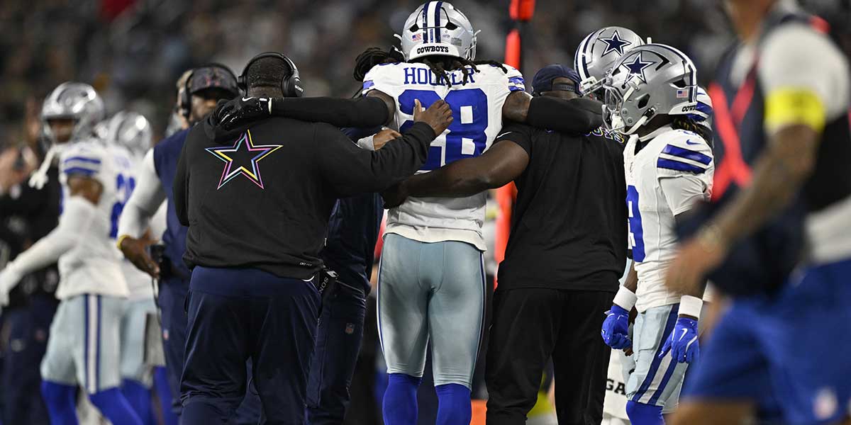 Dallas Cowboys safety Malik Hooker (28) is helped off the field in the second quarter against the Green Bay Packers at AT&T Stadium.