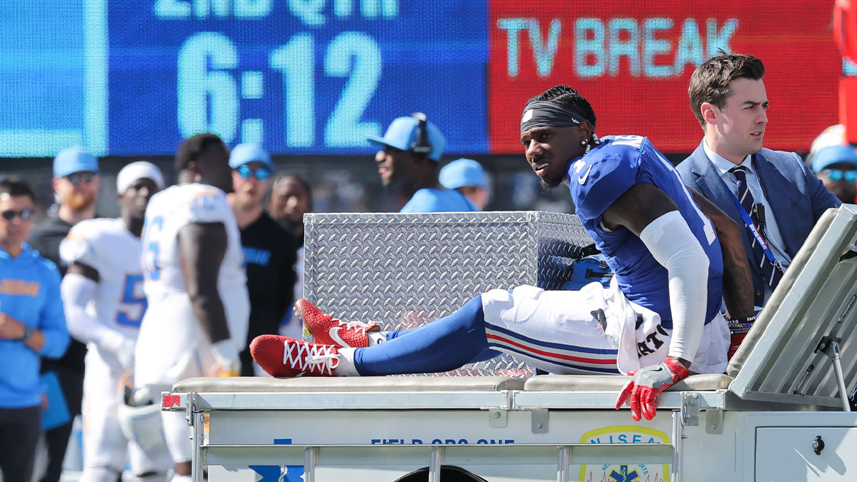 New York Giants wide receiver Malik Nabers (1) is carted off the field following an injury during the second quarter against the Los Angeles Chargers at MetLife Stadium.