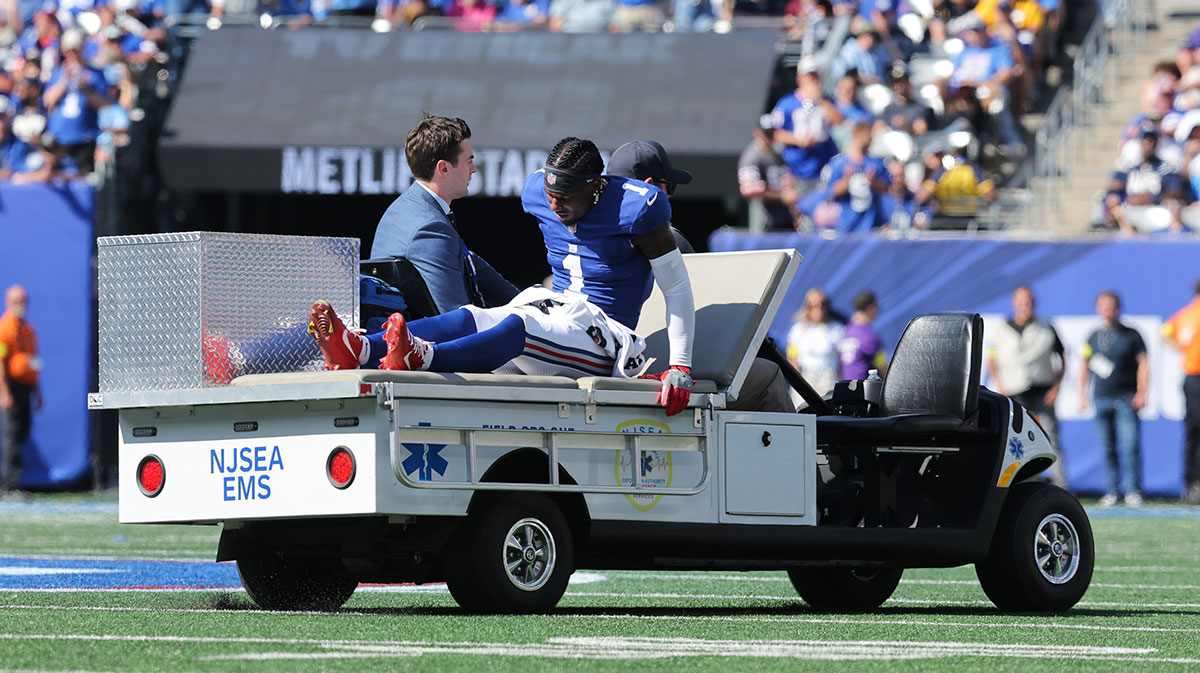; New York Giants wide receiver Malik Nabers (1) is carted off the field following an injury during the second quarter against the Los Angeles Chargers at MetLife Stadium.