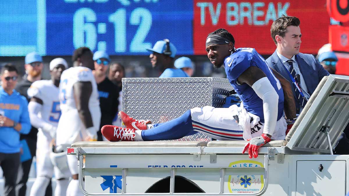 New York Giants wide receiver Malik Nabers (1) is carted off the field following an injury during the second quarter against the Los Angeles Chargers at MetLife Stadium.