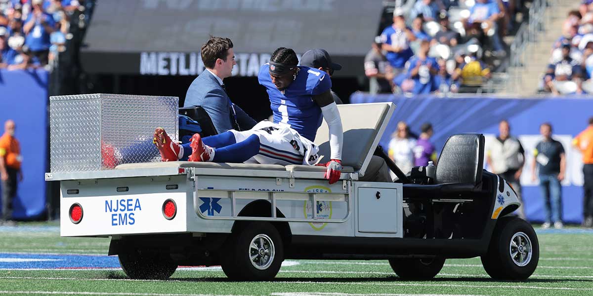 New York Giants wide receiver Malik Nabers (1) is carted off the field following an injury during the second quarter against the Los Angeles Chargers at MetLife Stadium.