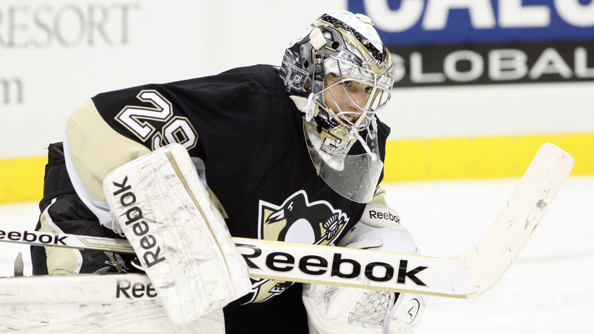 Pittsburgh Penguins goalie Marc-Andre Fleury (29) stretches during a time-out against the New York Islanders during the first period at the CONSOL Energy Center. The New York Islanders won 4-1.