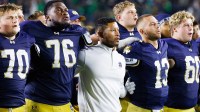Notre Dame head coach Marcus Freeman celebrates with his players after winning a NCAA football game 56-30 against Purdue at Notre Dame Stadium