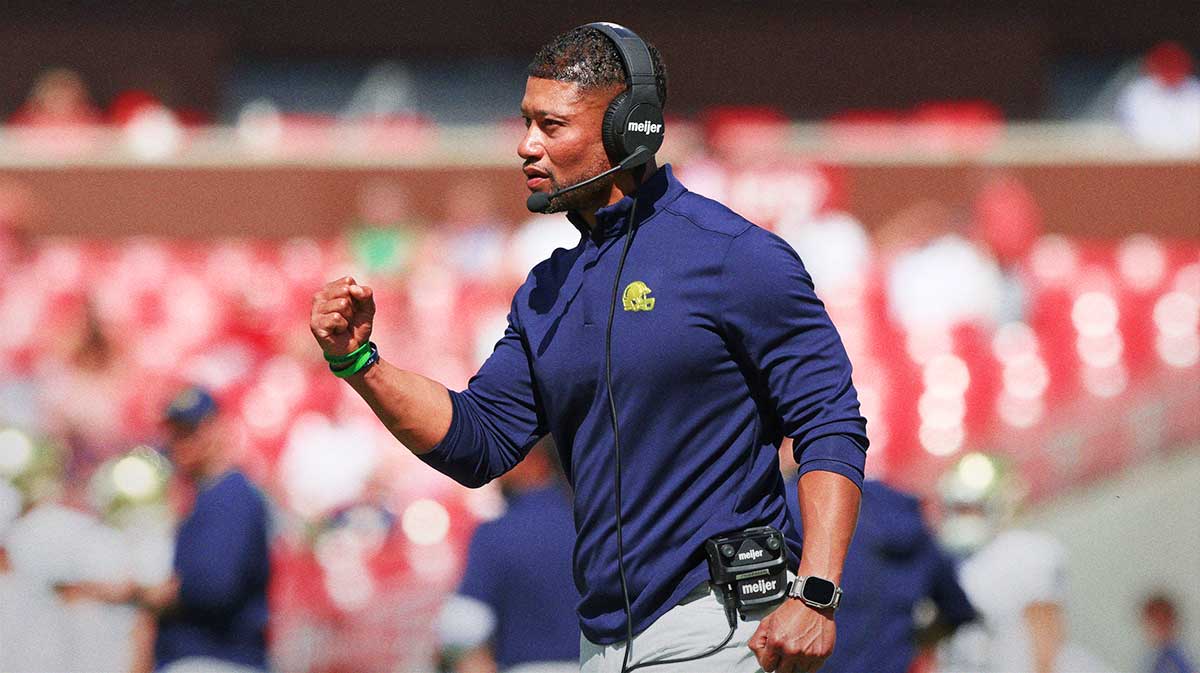 Notre Dame Fighting Irish head coach Marcus Freeman celebrates after a score during the third quarter against the Arkansas Razorbacks at Donald W. Reynolds Razorback Stadium. Notre Dame won 56-13.