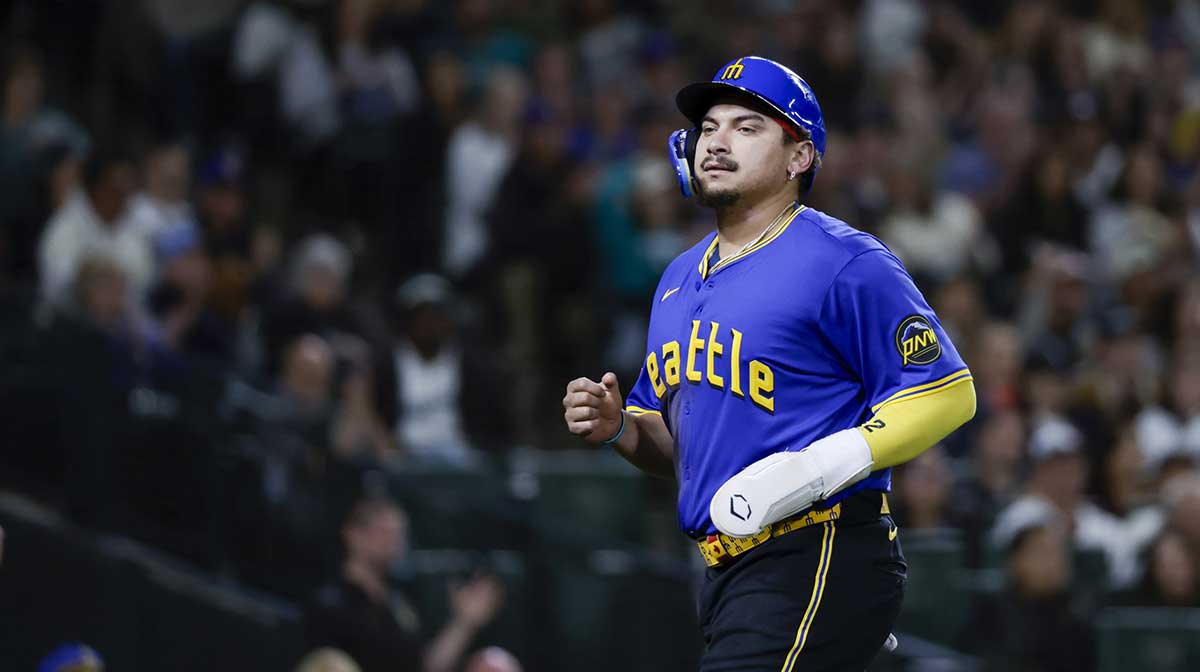 Seattle Mariners first baseman Josh Naylor (12) jogs to the dugout after scoring a run against the Colorado Rockies during the fourth inning at T-Mobile Park.