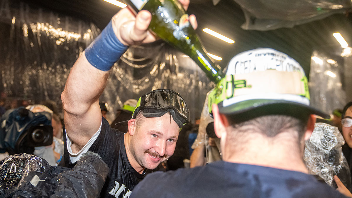 Mariners catcher Cal Raleigh (29), left, celebrates