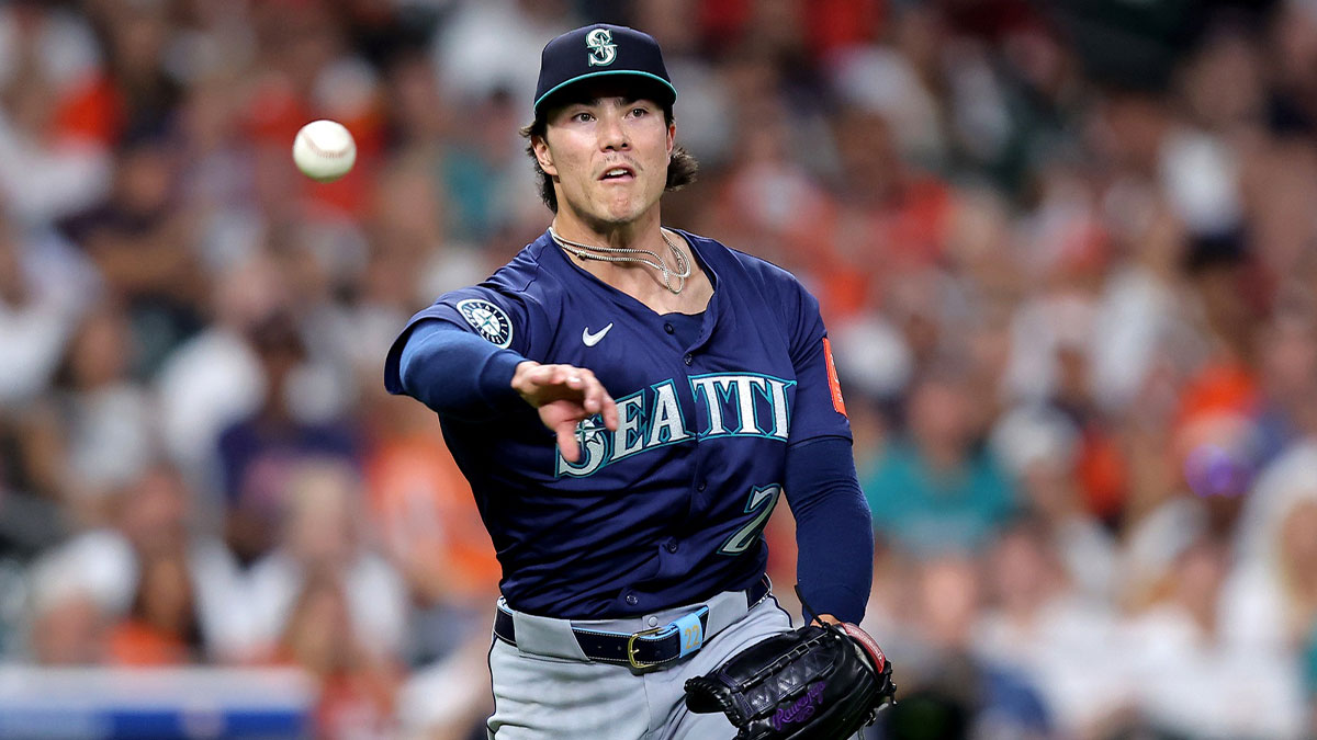 Seattle Mariners pitcher Bryan Woo (22) throws a fielded ball to first base for an out against the Houston Astros during the second inning at Daikin Park.