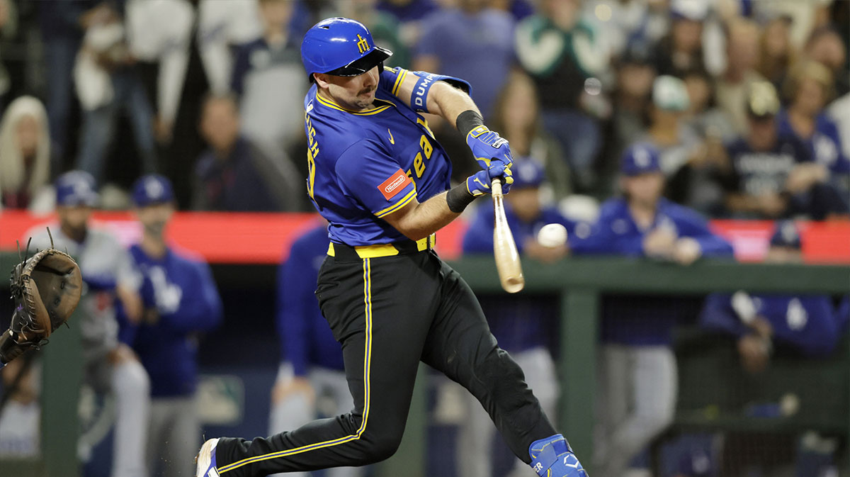 Seattle Mariners catcher Cal Raleigh (29) hits a double against the Los Angeles Dodgers during the ninth inning at T-Mobile Park.