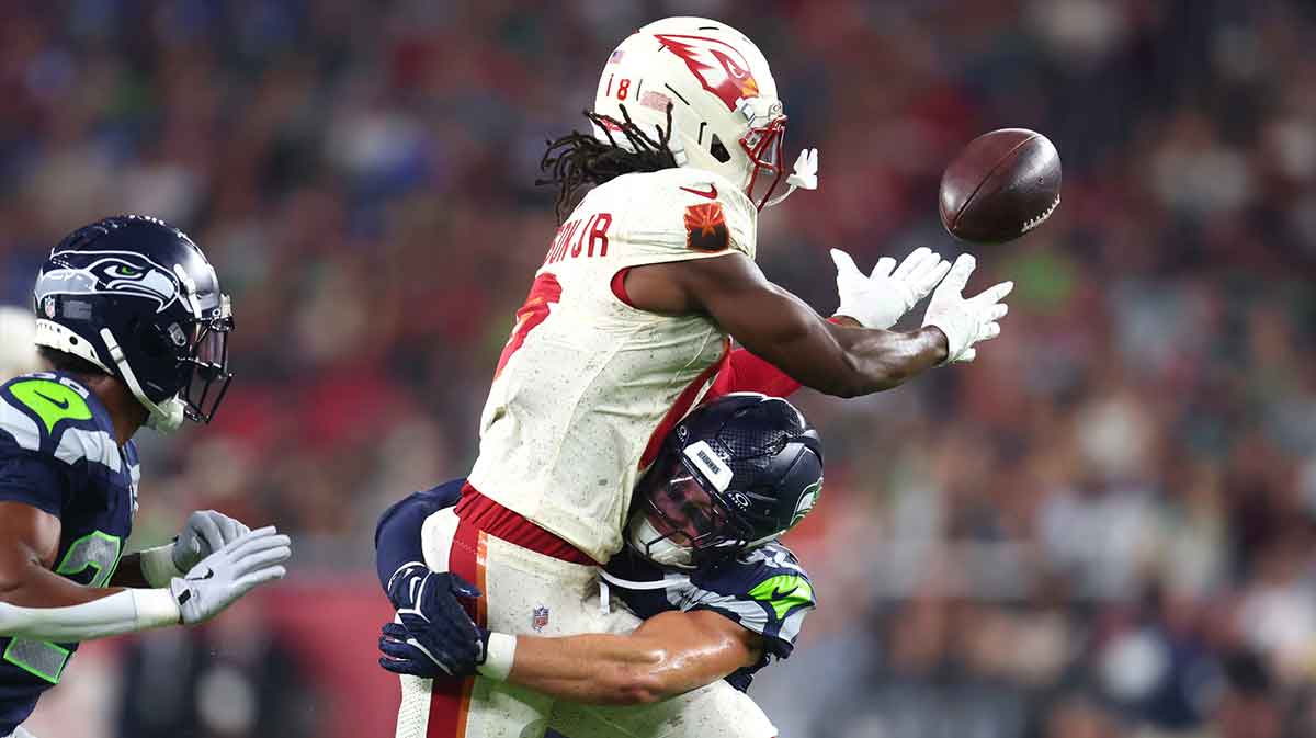 Arizona Cardinals wide receiver Marvin Harrison Jr. (18) cannot make a catch against Seattle Seahawks linebacker Drake Thomas (42) in the first half at State Farm Stadium.