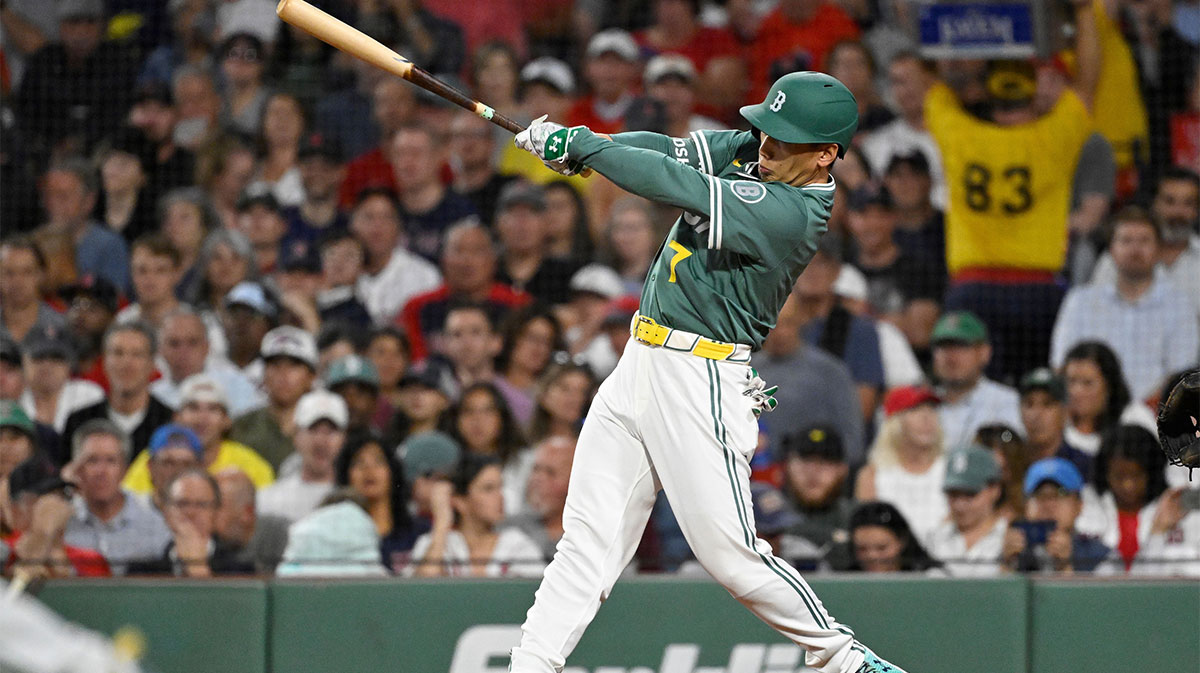 Boston Red Sox designated hitter Masataka Yoshida (7) hits a one run RBI single during the fourth inning against the Detroit Tigers at Fenway Park.