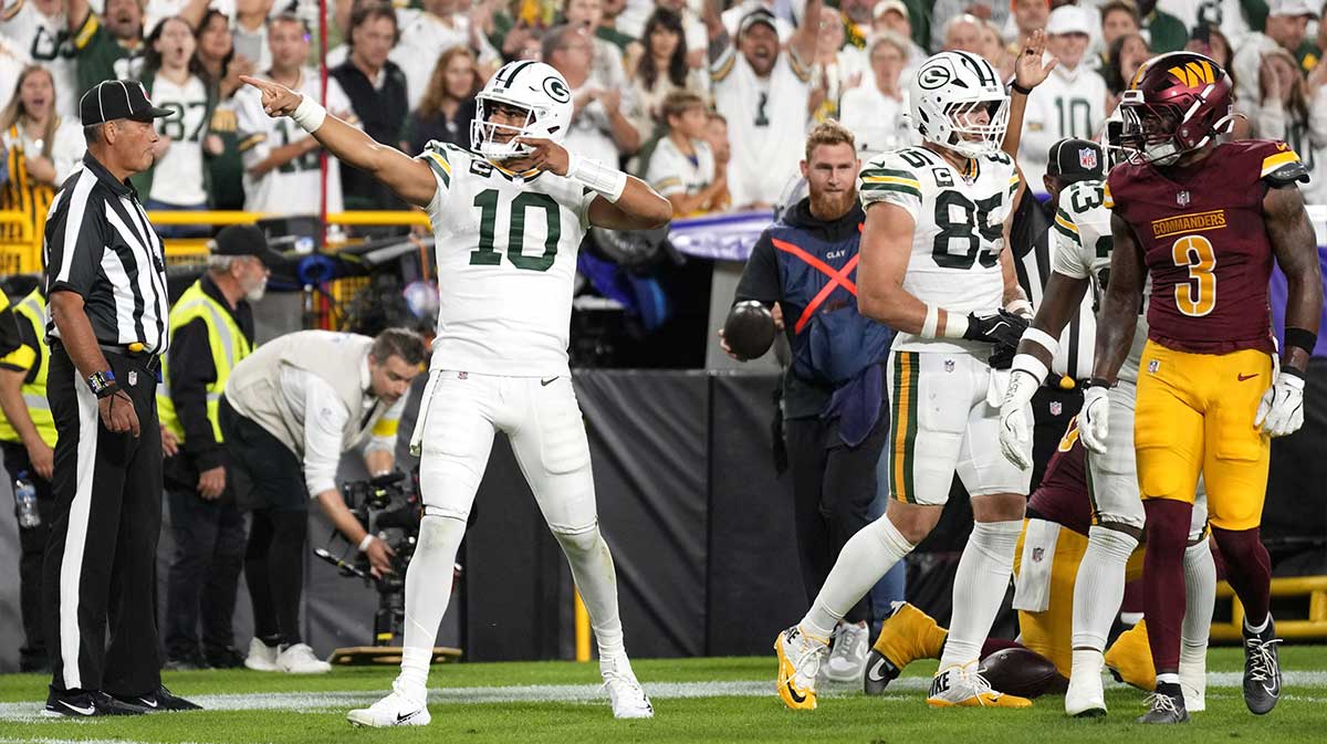 Green Bay Packers quarterback Jordan Love (10) reacts after a first down against the Washington Commanders in the first quarter at Lambeau Field.