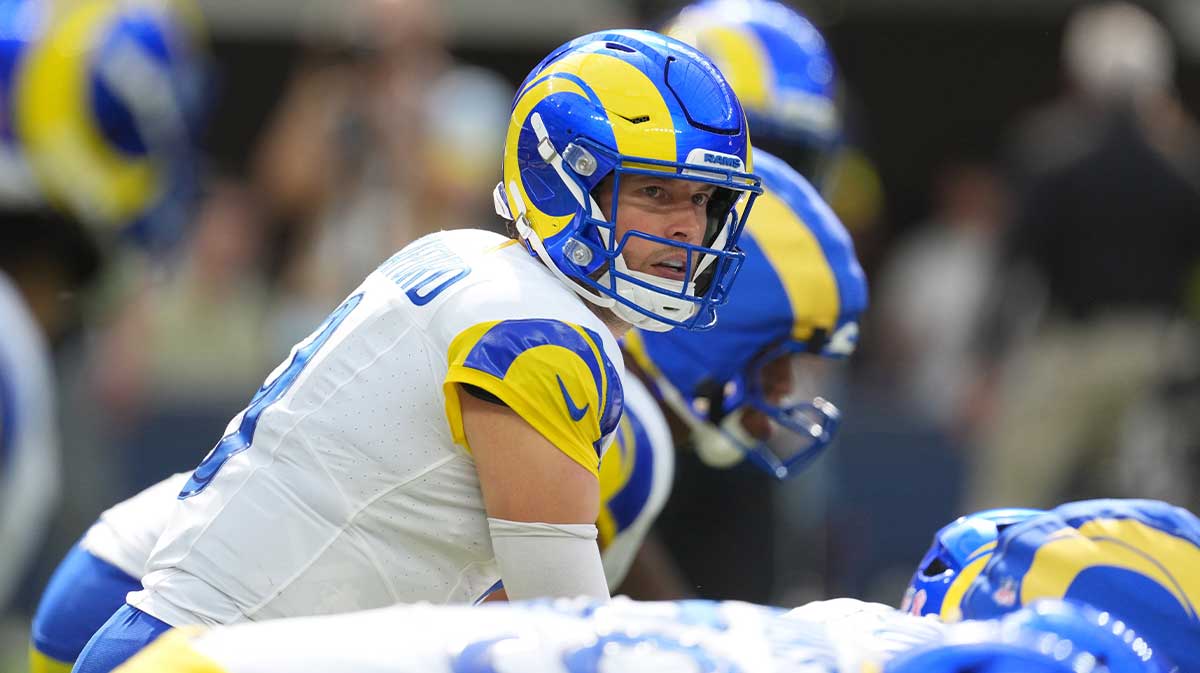 Los Angeles Rams quarterback Matthew Stafford (9) takes the snap against the Houston Texans in the second half at SoFi Stadium.