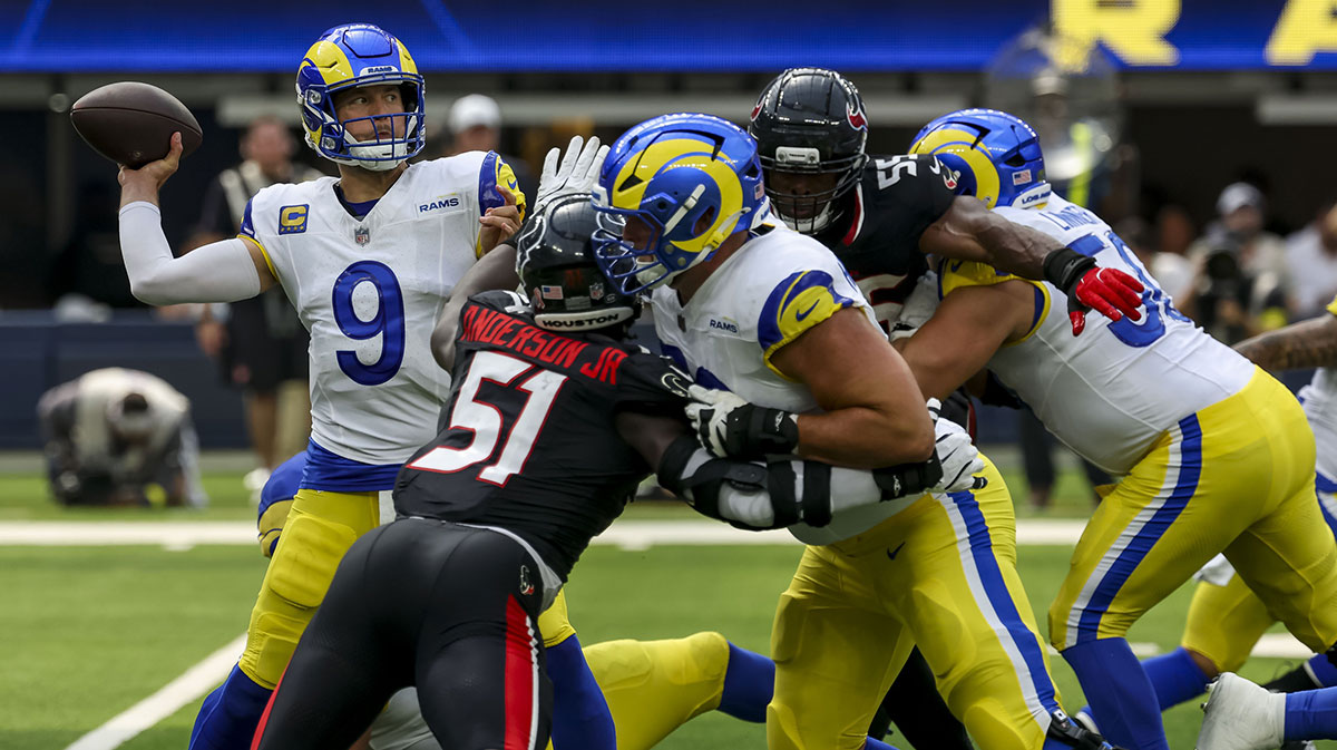 Los Angeles Rams quarterback Matthew Stafford (9) looks to pass during the second quarter at SoFi Stadium.