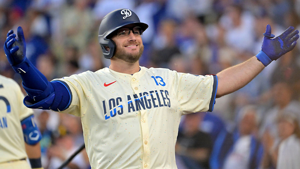 Los Angeles Dodgers third baseman Max Muncy (13) celebrates after hitting a two-run home run in the first inning against the San Francisco Giants at Dodger Stadium.