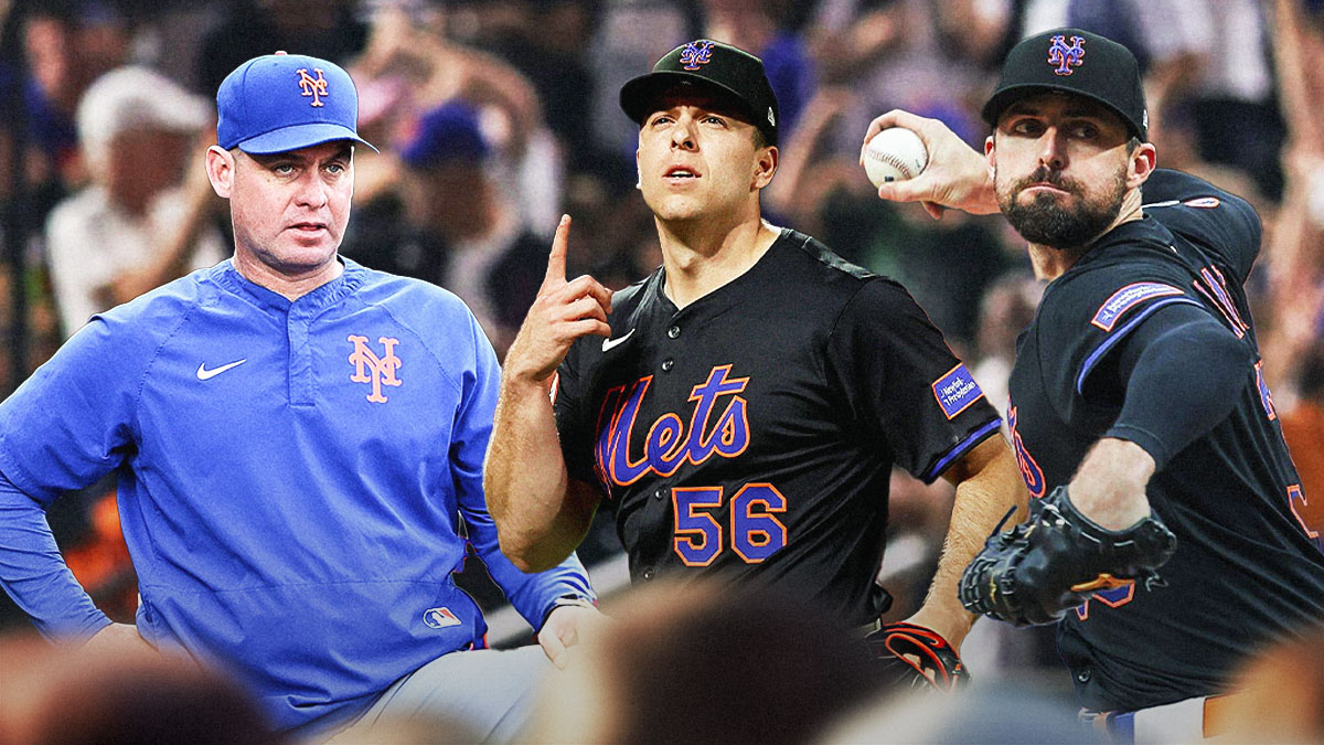 Mets manager Carlos Mendoza looks on at Ryan Helsley and Clay Holmes. Citi Field background.