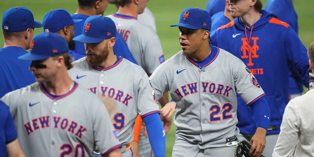New York Mets right fielder Juan Soto (22) congratulates his teammates following a victory against the Miami Marlins at loanDepot Park.