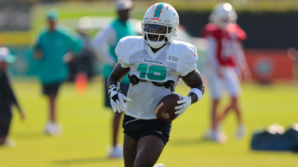 Miami Dolphins wide receiver Tyreek Hill (10) runs with the football during training camp at Baptist Health Training Complex.