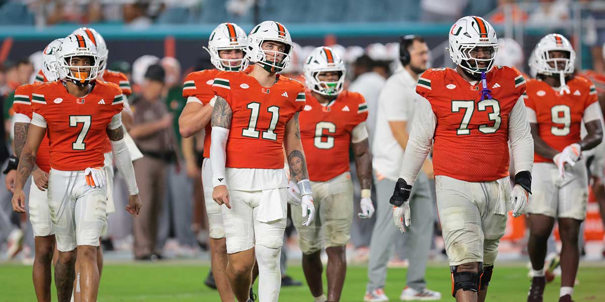 Miami Hurricanes quarterback Carson Beck (11) and his teammates walk toward the line of scrimmage against the Florida Gators during the fourth quarter at Hard Rock Stadium.