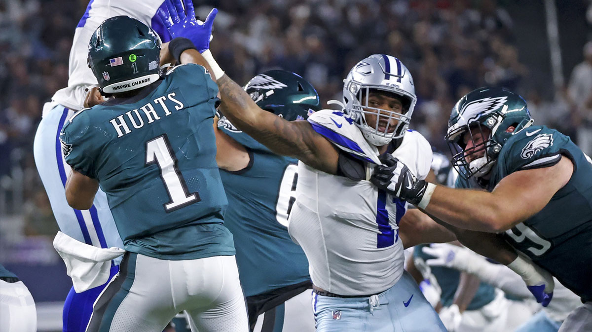 Dallas Cowboys linebacker Micah Parsons (11) rushes Philadelphia Eagles quarterback Jalen Hurts (1) during the game at AT&T Stadium.
