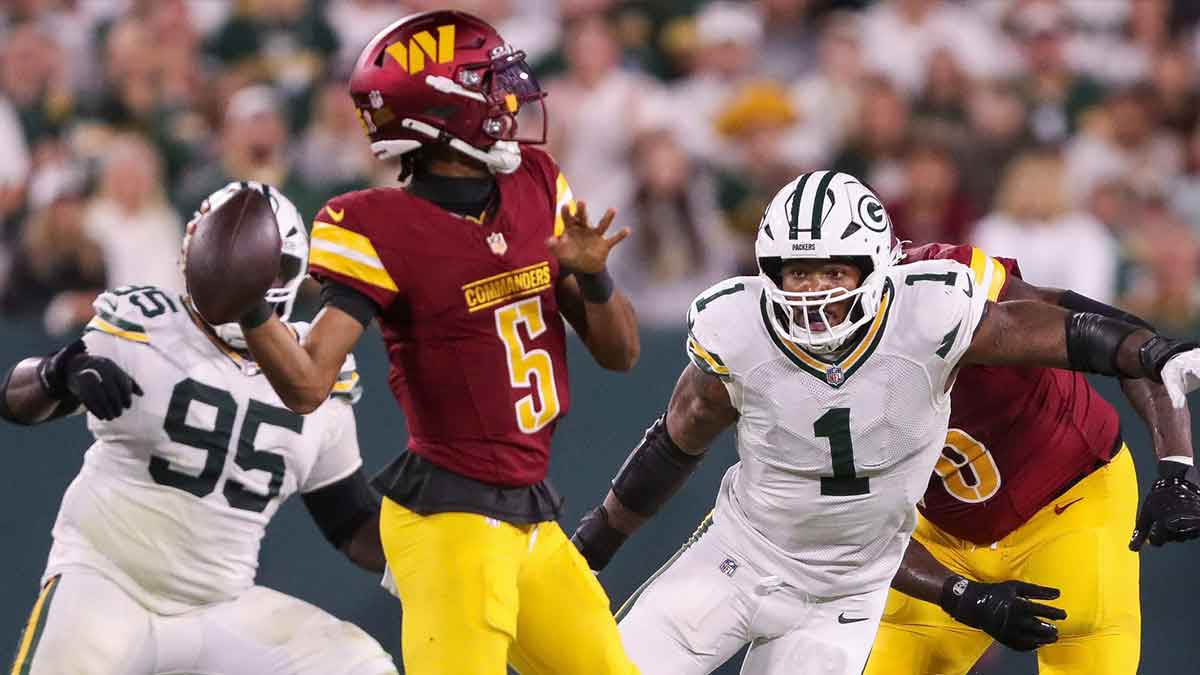 Green Bay Packers defensive end Micah Parsons (1) rushes Washington Commanders quarterback Jayden Daniels (5) on Thursday, September 11, 2025, at Lambeau Field in Green Bay, Wis. The Packers won the game, 27-18.