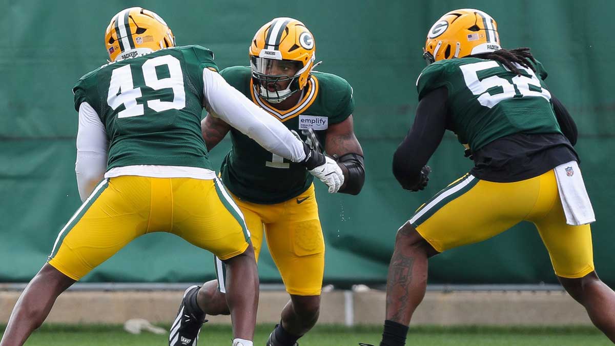 Micah Parsons (1) and Rashan Gary (52) run through a drill during practice on Wednesday, September 3, 2025, at Clarke Hinkle Field in Ashwaubenon, Wis.
