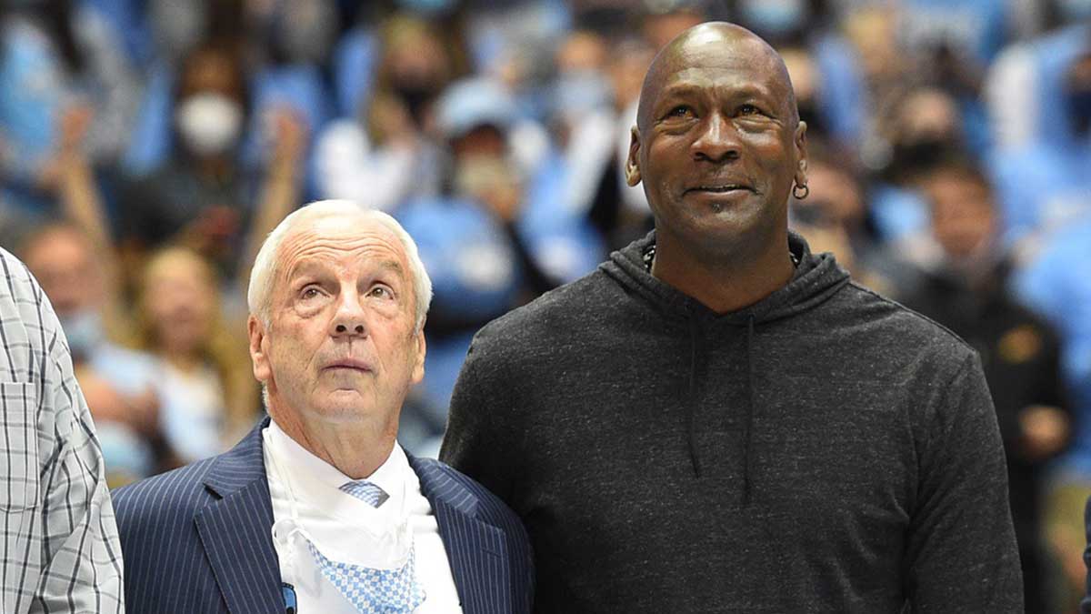 Former North Carolina Tar Heels head coach Roy Williams with former UNC great Michael Jordan on the court as they were honored as part of the 1982 national championship team in the second half at Dean E. Smith Center.