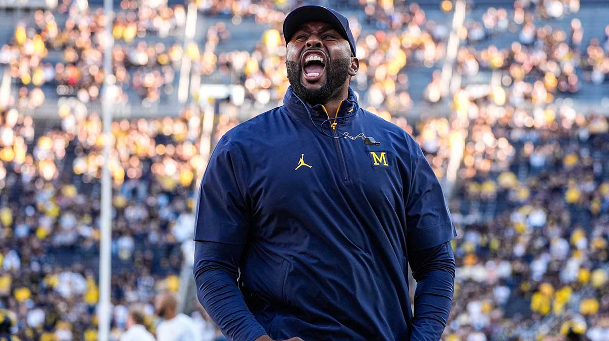 Michigan head coach Sherrone Moore fires up the student section during warm up ahead of the New Mexico game at Michigan Stadium in Ann Arbor on Saturday, August 30, 2025.
