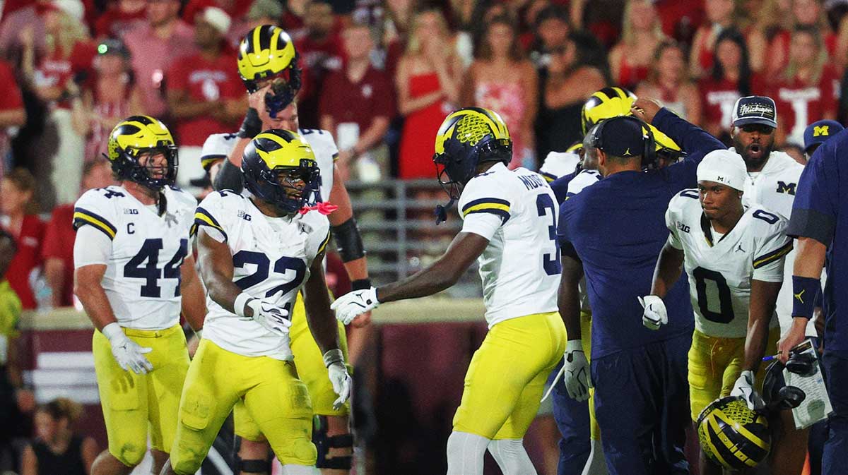 Michigan Wolverines running back Justice Haynes (22) celebrates with teammates after a 75-yard touchdown run against the Oklahoma Sooners during the second half at Gaylord Family-Oklahoma Memorial Stadium.