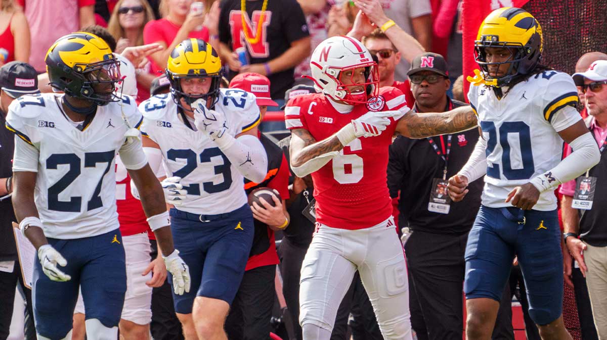 Nebraska Cornhuskers wide receiver Dane Key (6) reacts after a catch against Michigan Wolverines defensive back Jayden Sanders (27), linebacker Cole Sullivan (23) and defensive back Jyaire Hill (20) during the second quarter at Memorial Stadium.