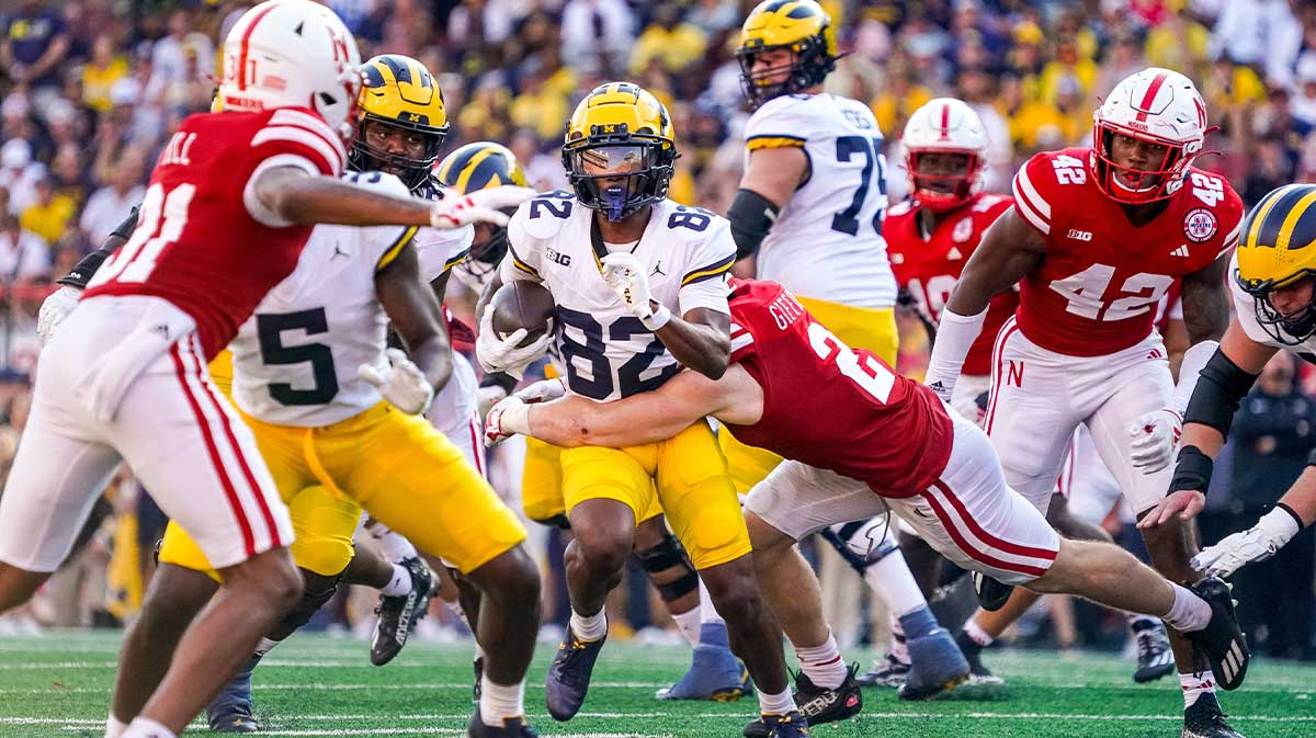 Michigan Wolverines wide receiver Semaj Morgan (82) is tackled by Nebraska Cornhuskers defensive back Isaac Gifford (2) during the third quarter at Memorial Stadium.