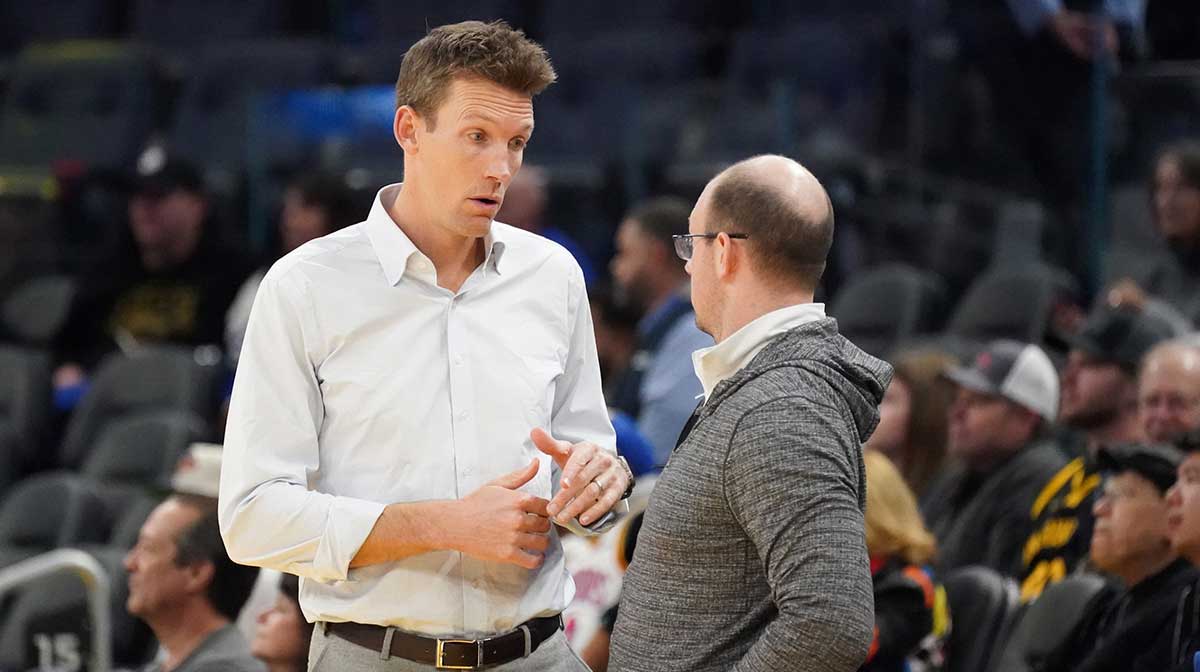 Golden State Warriors general manager Mike Dunleavy chats before the game against the Memphis Grizzlies at Chase Center.