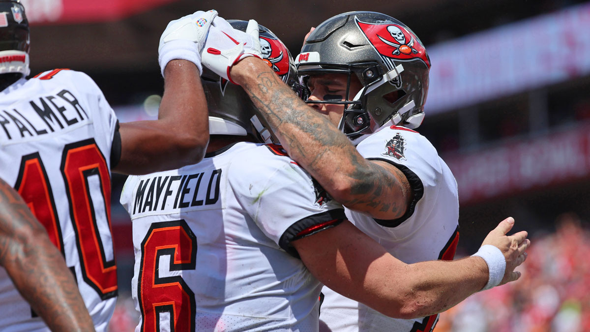 Tampa Bay Buccaneers wide receiver Mike Evans (13) is congratulated by quarterback Baker Mayfield (6) after scoring a touchdown against the Chicago Bears during the second half at Raymond James Stadium.