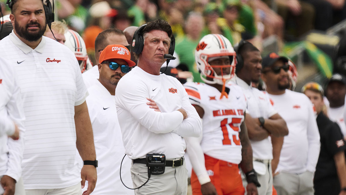 Oklahoma State Cowboys head coach Mike Gundy looks up from the sidelines during the first half in a game against the Oregon Ducks at Autzen Stadium. Mandatory