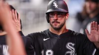 Chicago White Sox right fielder Mike Tauchman (18) celebrates with teammates after scoring a run against the Atlanta Braves in the fourth inning at Truist Park.