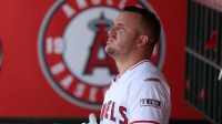 Los Angeles Angels designated hitter Mike Trout (27) looks on from the dugout during the first inning against the Minnesota Twins at Angel Stadium.