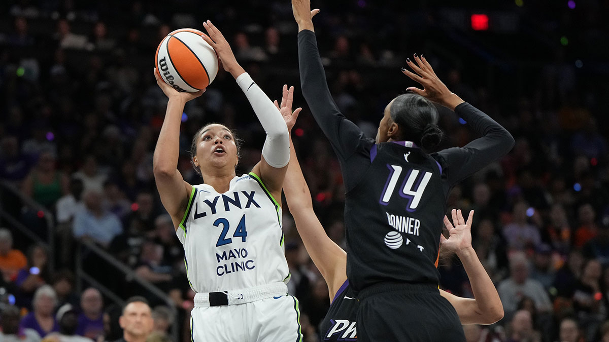 Minnesota Lynx forward Napheesa Collier (24) shoots over Phoenix Mercury forward DeWanna Bonner (14) during game three of the second round for the 2025 WNBA Playoffs at PHX Arena.
