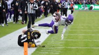 Minnesota Vikings wide receiver Jordan Addison (3) carries the ball on an 81-yard reception against Pittsburgh Steelers linebacker Payton Wilson (41) in the fourth quarter during an NFL International Series game at Croke Park.